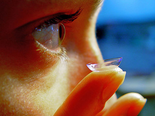 Contact lens about to be placed in eye